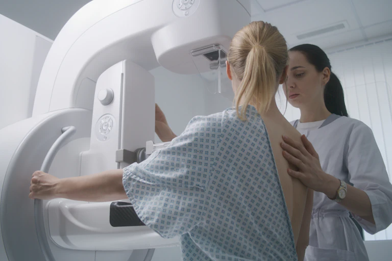 Woman attending a breast cancer screening appointment.