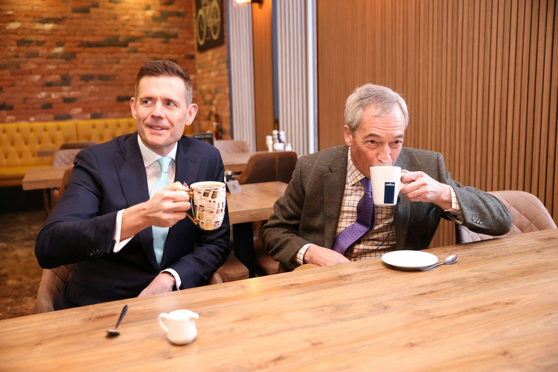 Matt Goodwin and Nigel Farage drinking tea.