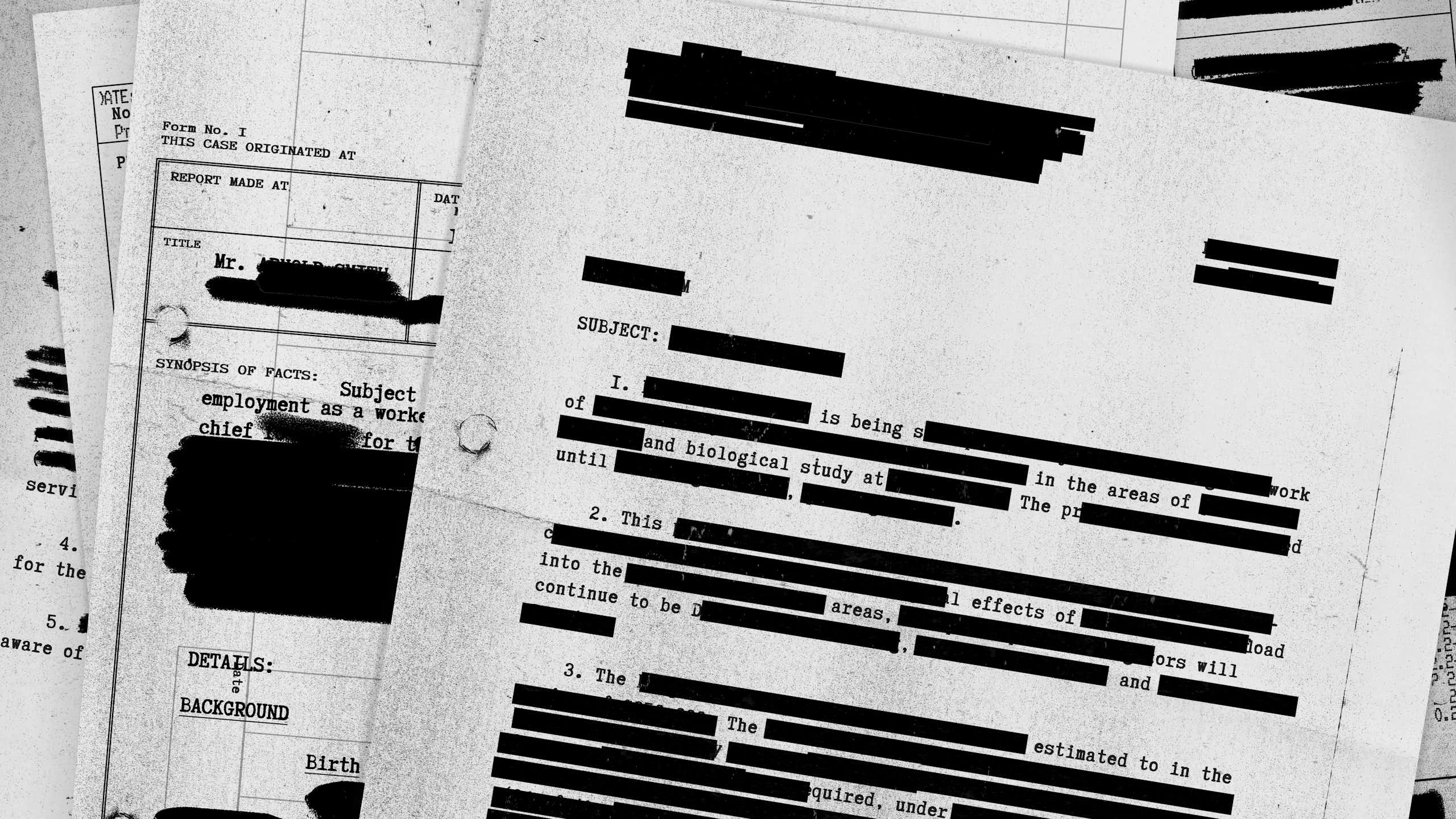 A stock photo montage of redacted documents.