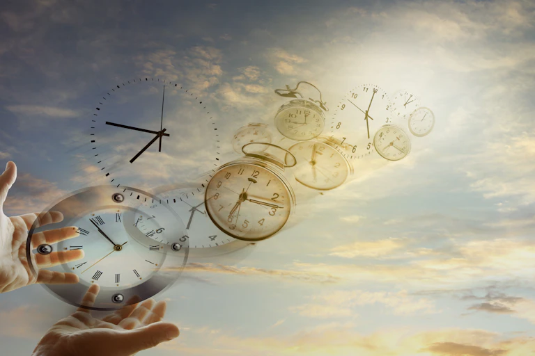 Hands and clocks in sky