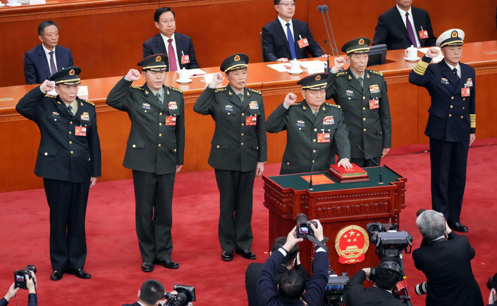 A group of top Chinese military officers swearing an oath.