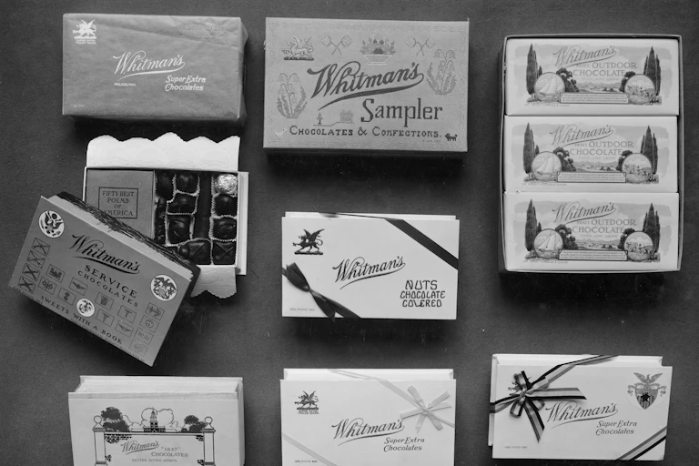 Old black-and-white photographs of different boxes of chocolate