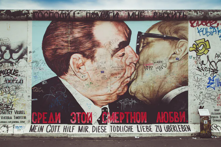 Street art on the Berlin Wall showing Leonid Brezhnev and Erich Honecker kissing