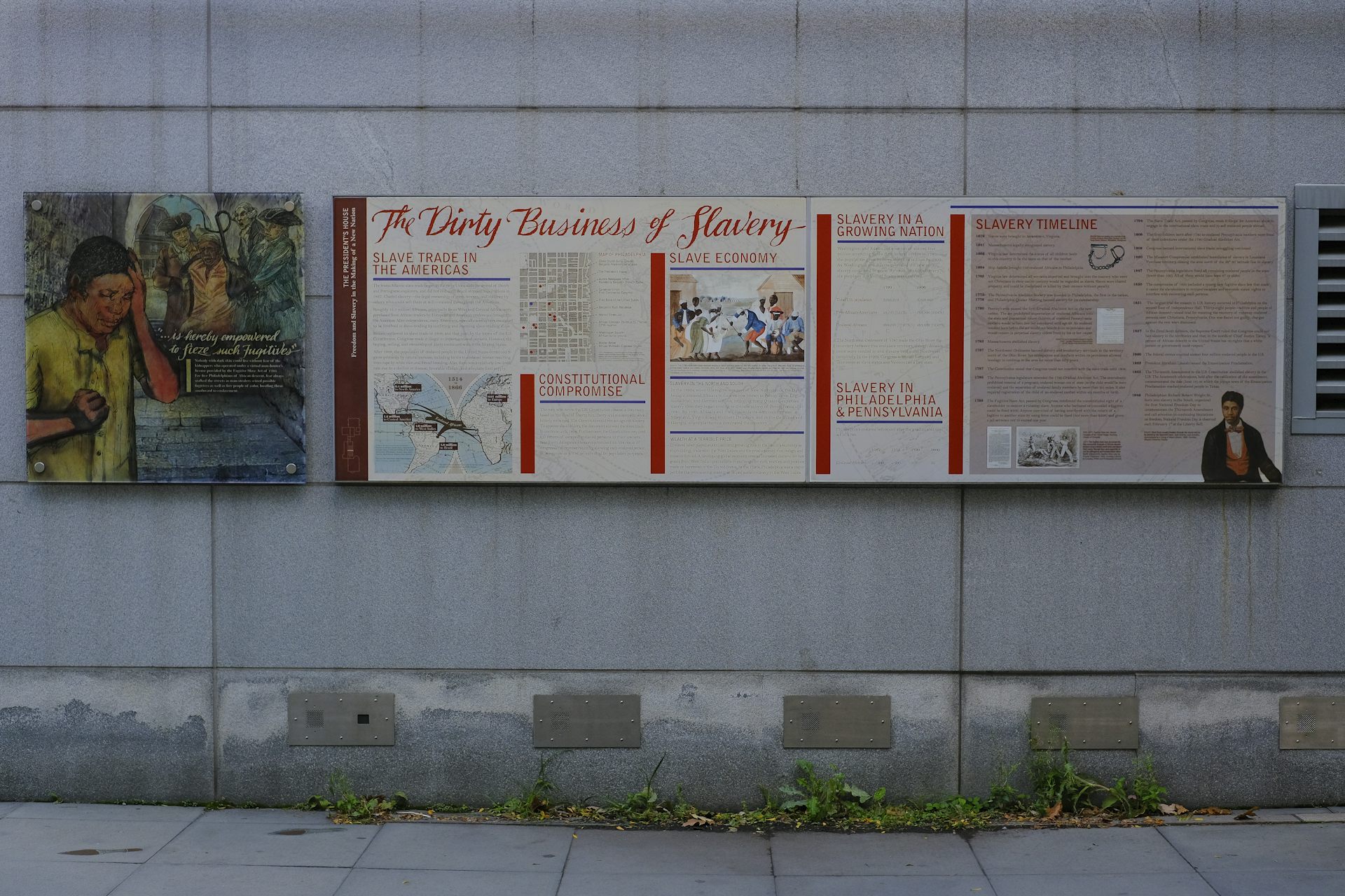 Panels with pictures and text affixed to the exterior of a building