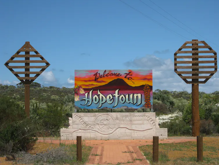 a sign, 'Hopetoun', at a beachfront path