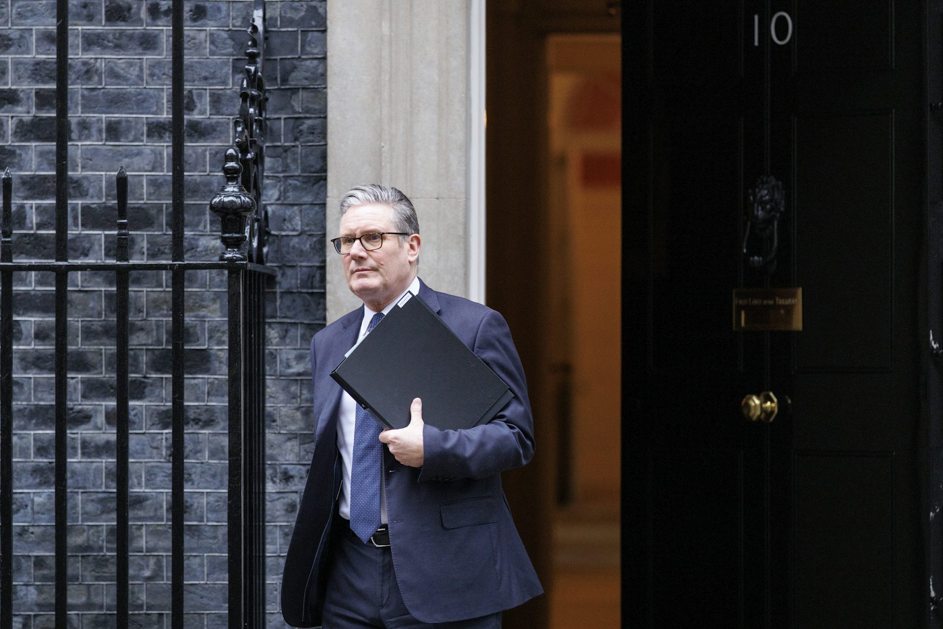 Keir Starmer walking out of 10 Downing Street. 