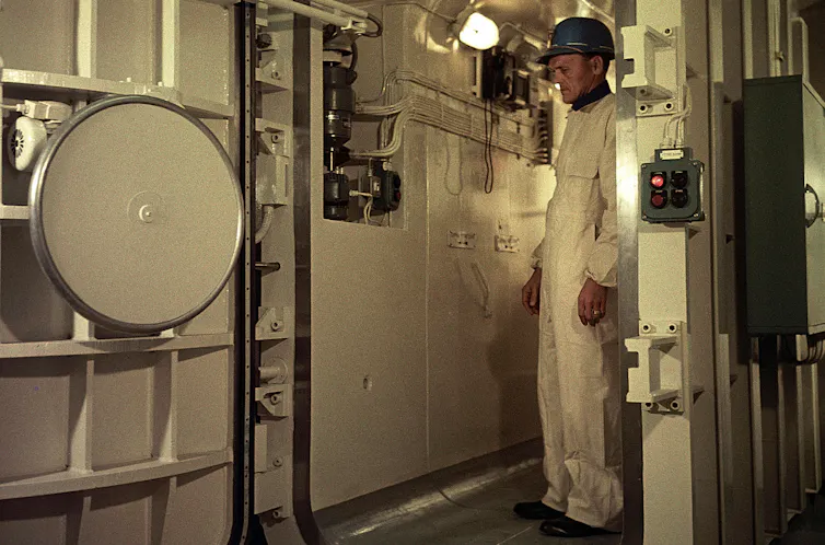 Man in protective gear photographed working inside a Swedish nuclear power station.