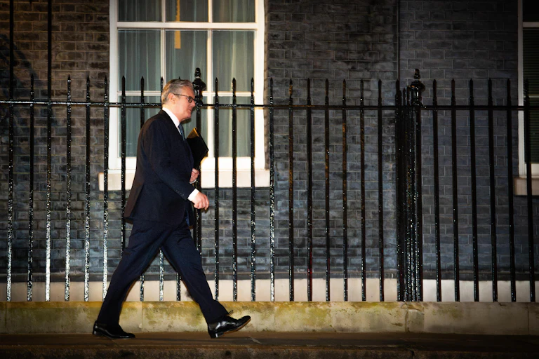 Keir Starmer walking down Downing Street.