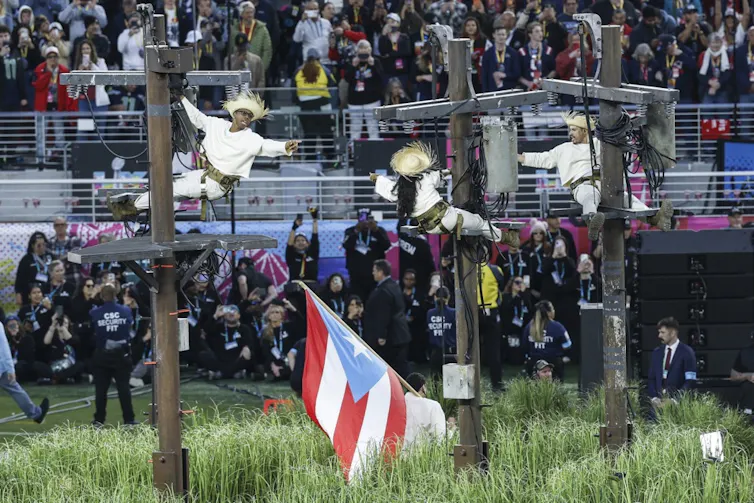 People climbing electricity poles sparked in a reference to constant power outages in Puerto Rico.