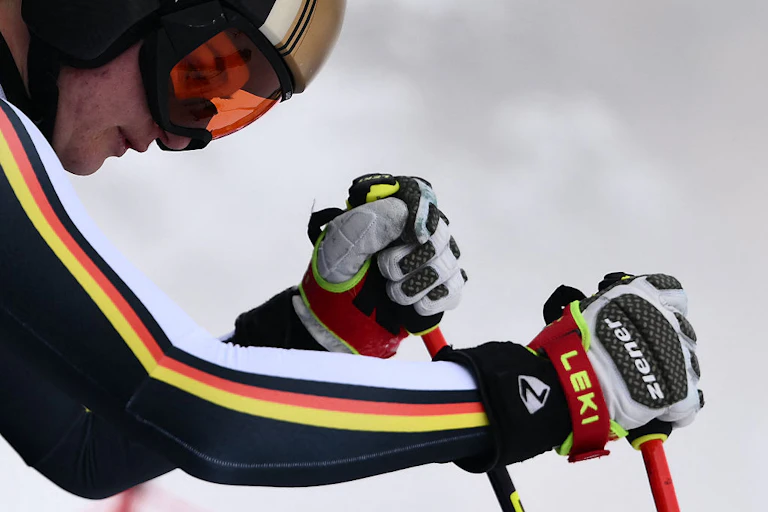 Close-up of skier Emma Aicher in full gear, looking down