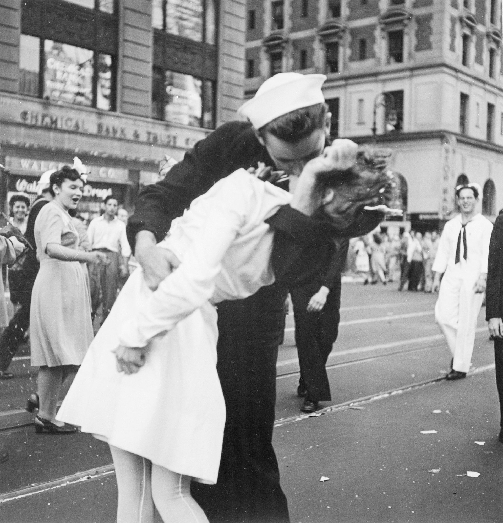 Photograph of a sailor kissing a nurse on V-J Day.