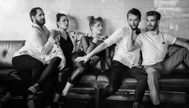 Black and white photo of five actors