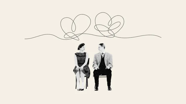 Man and woman sitting on chair with hearts squiggles above heads