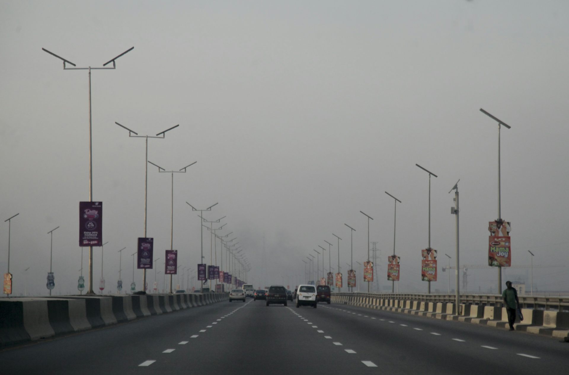 A road lined with tall poles