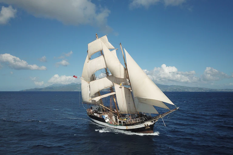 tall ship under sail on blue sea