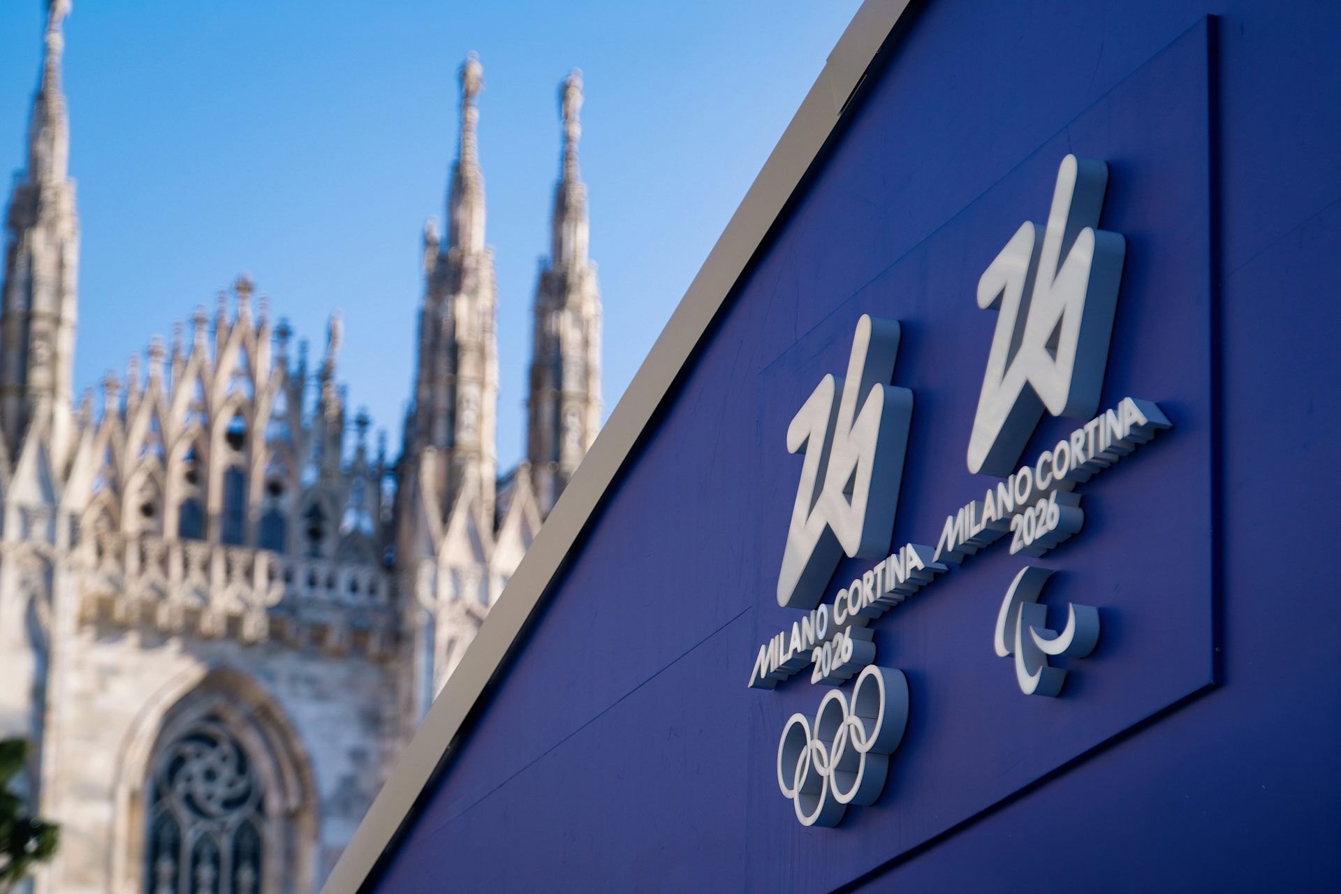 A view of Milan Cathedral next to a Winter Olympics 2026 hoarding.