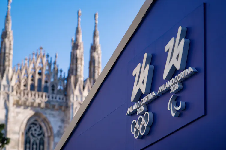 A view of Milan Cathedral next to a Winter Olympics 2026 hoarding.