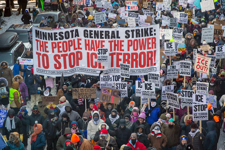 People protest in Minneapolis with a sign saying Minnesota general strike