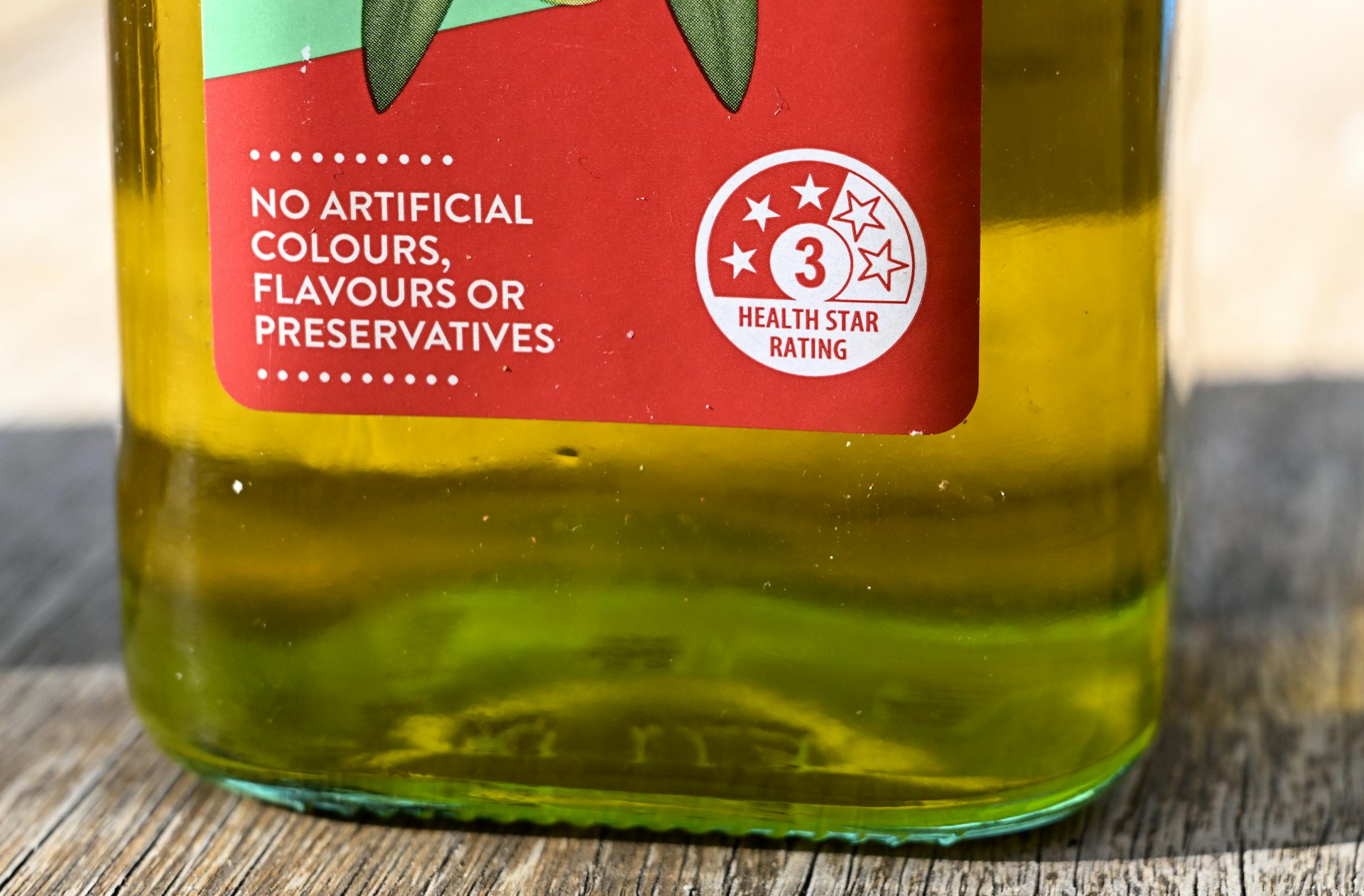 A close-up of the label on a bottle of oil.