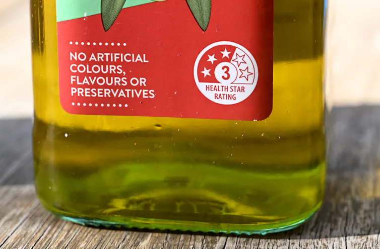 A close-up of the label on a bottle of oil.