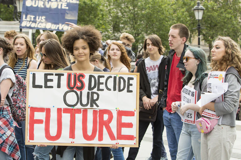 Young people with placards