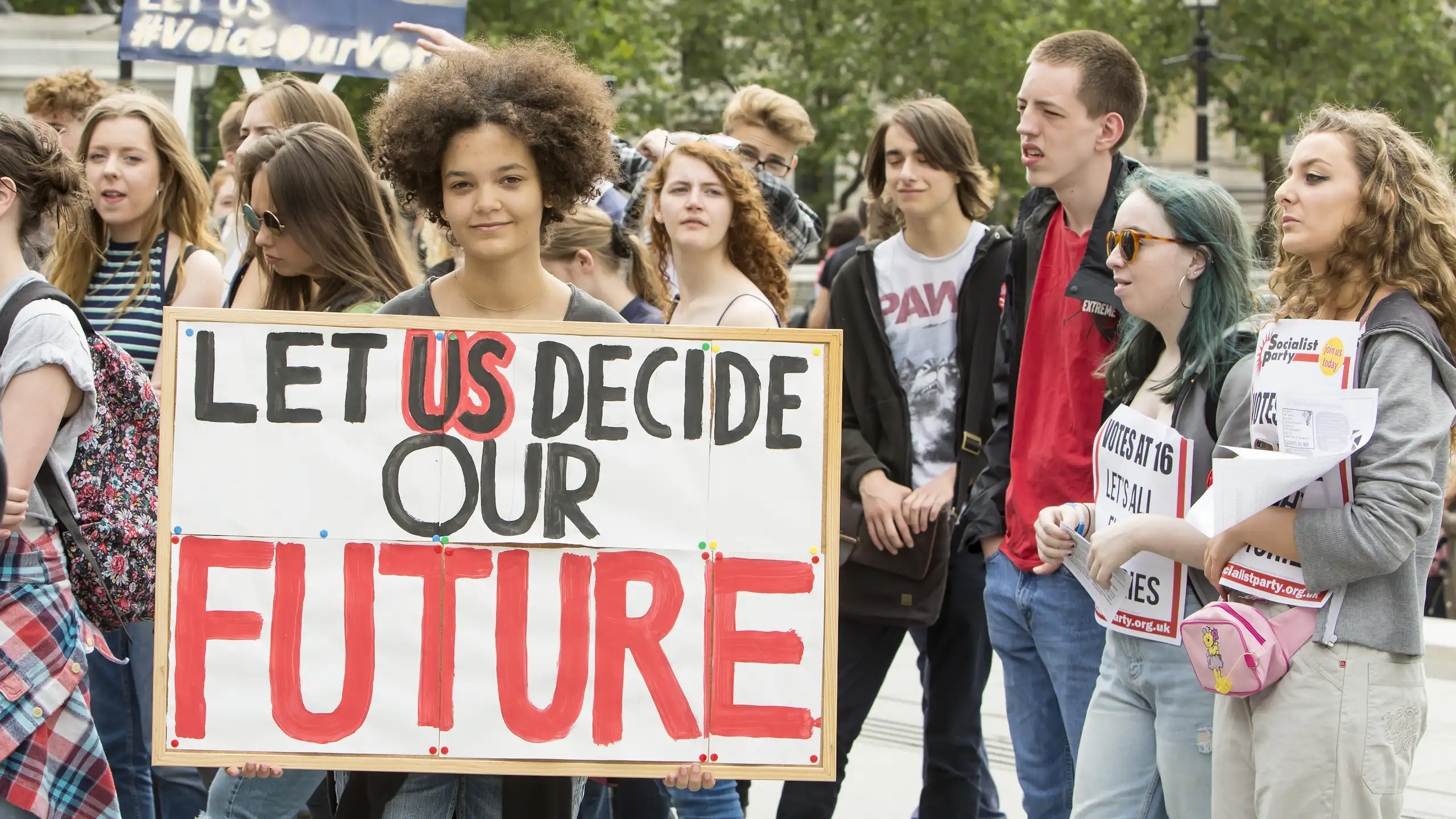 Young people with placards