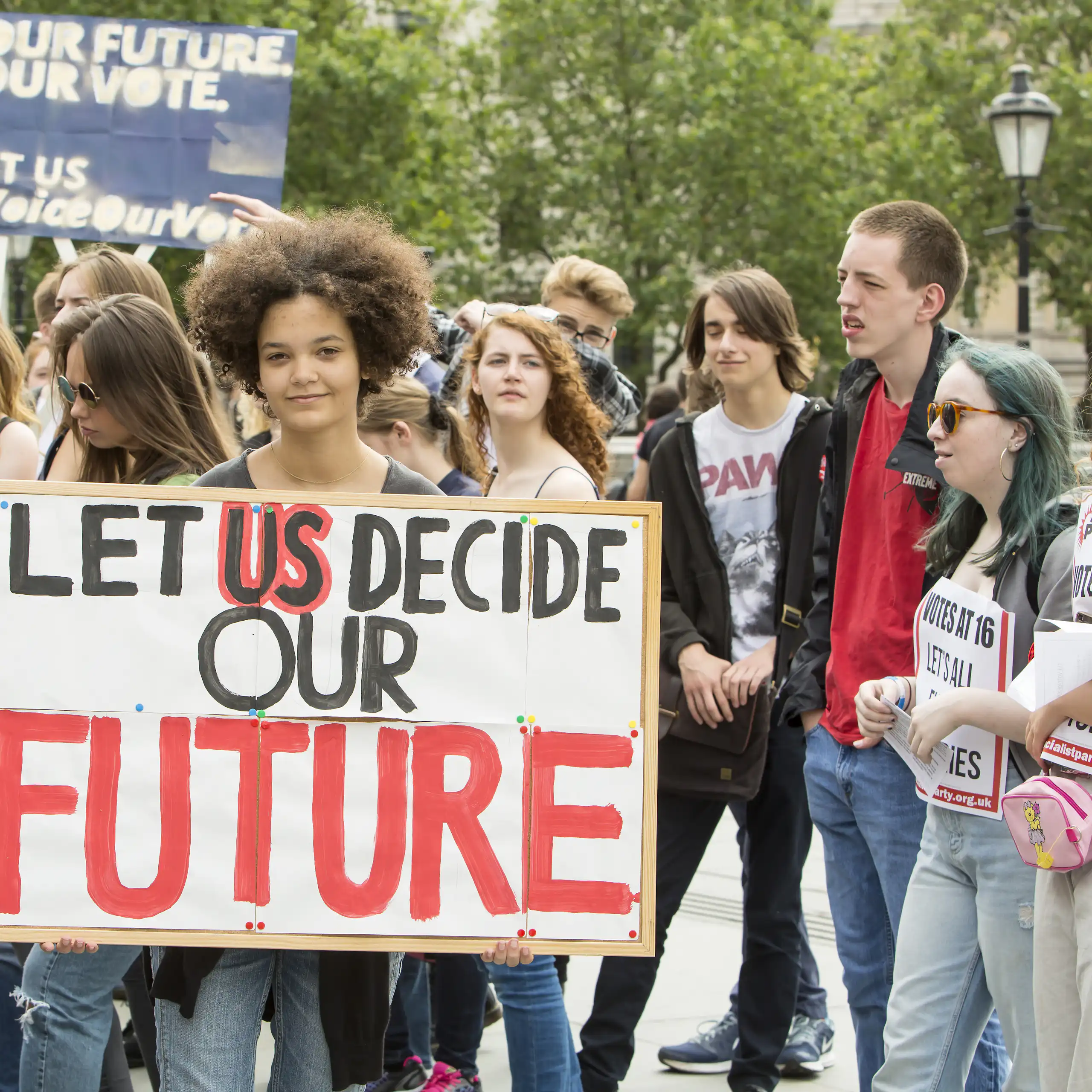 Young people with placards