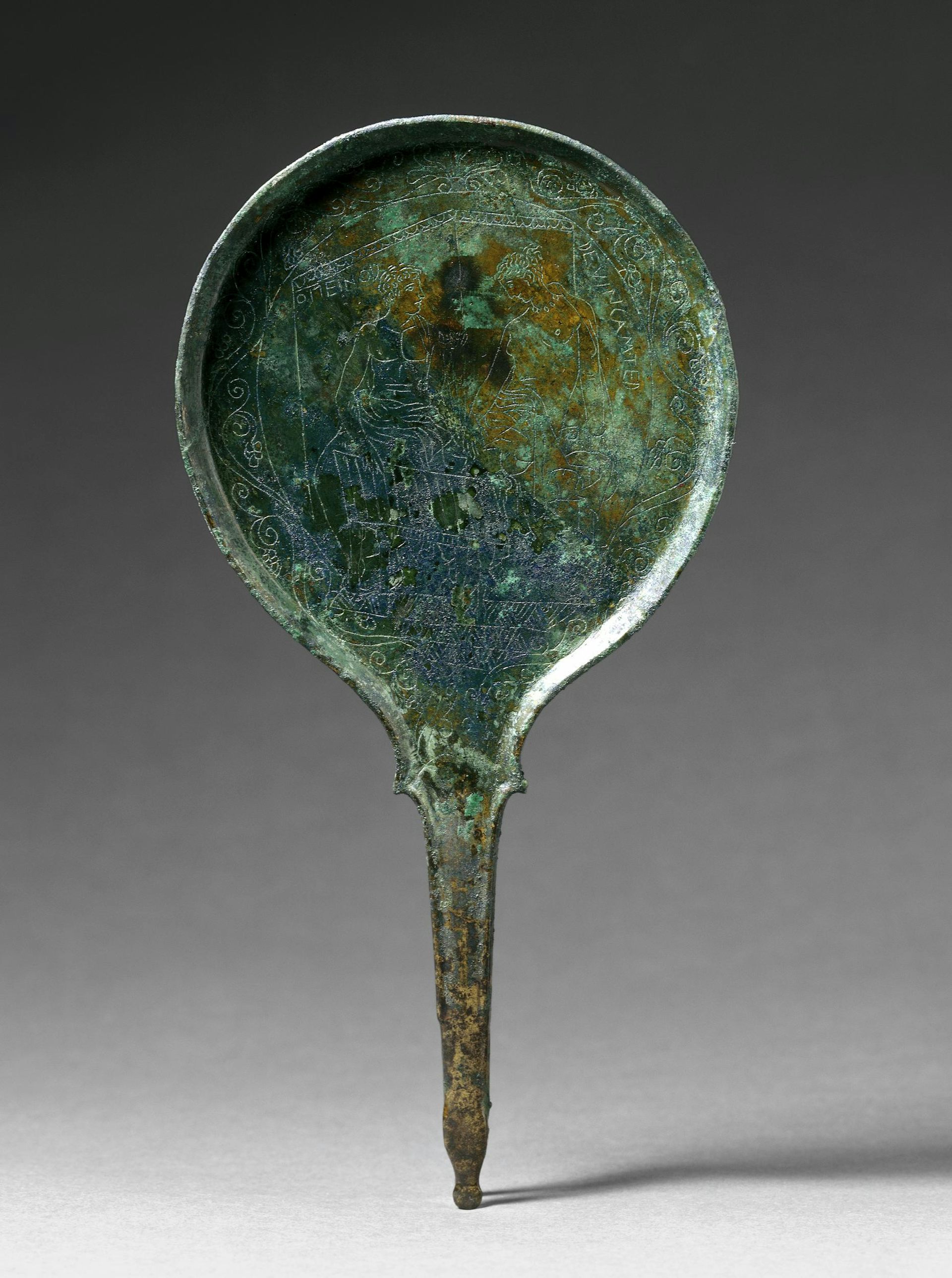 Mirror featuring a couple playing what is believed to be the dice game pentigrami.