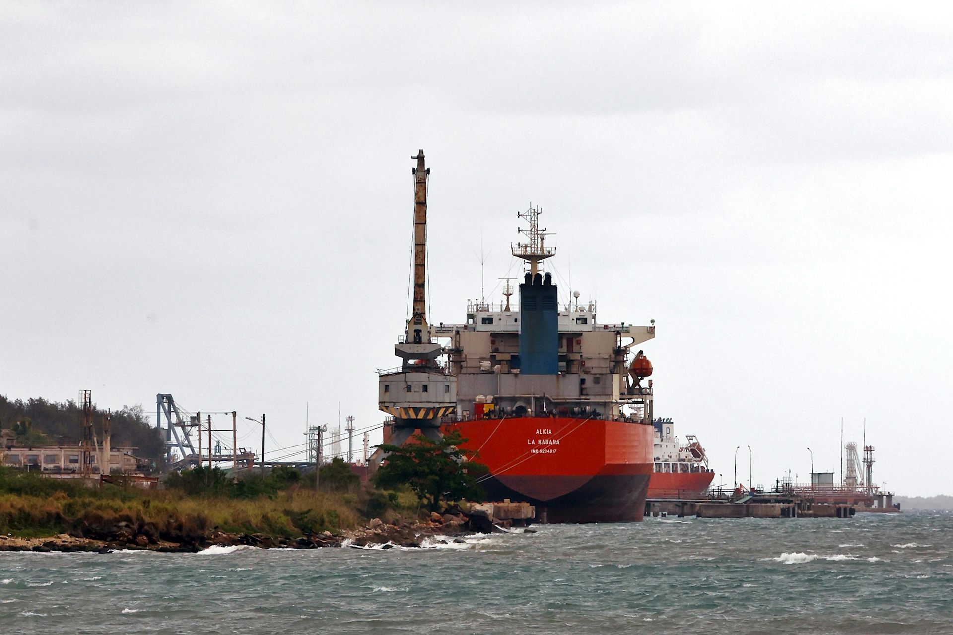 A Cuban oil tanker docked in a bay.