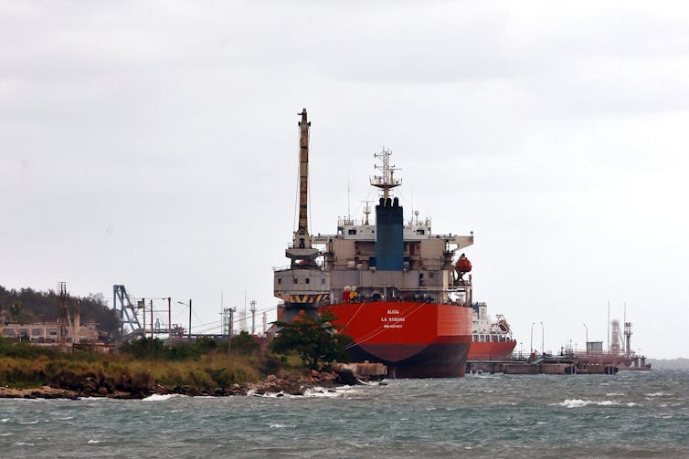 A Cuban oil tanker docked in a bay.