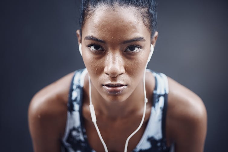 A sweating female athlete.