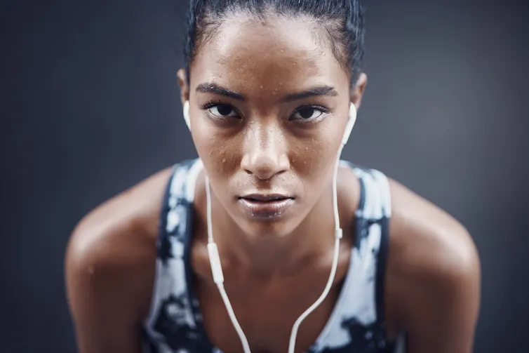 A sweating female athlete.