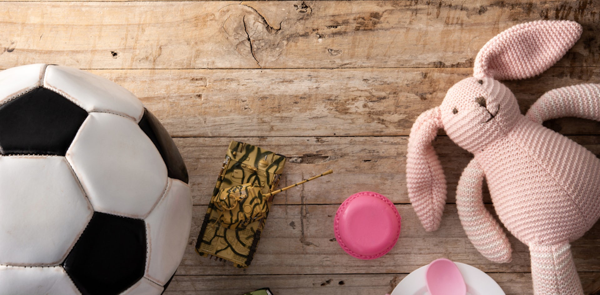 A pink bunny and a soccer ball representing gender stereotypes