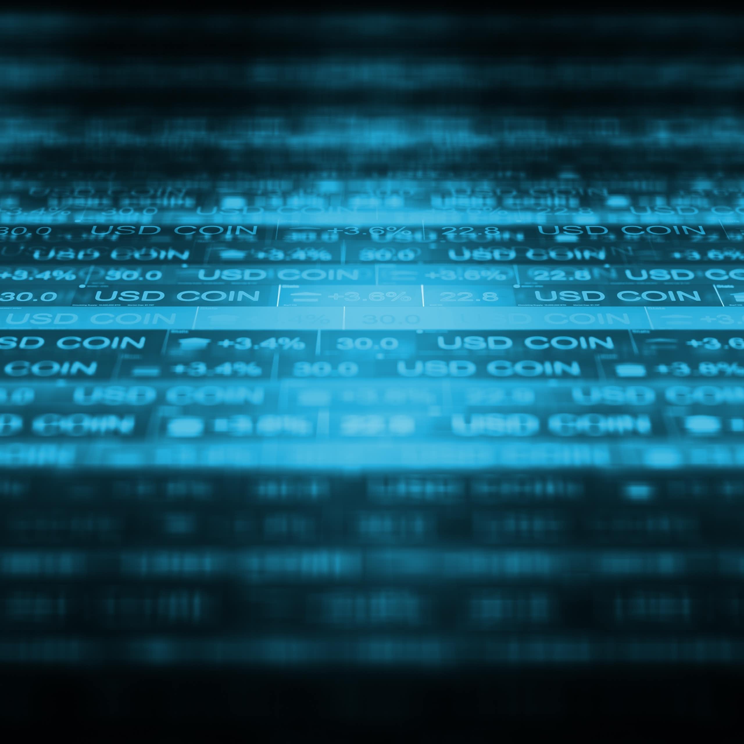 Ecran d'ordinateur avec des USD Coin.