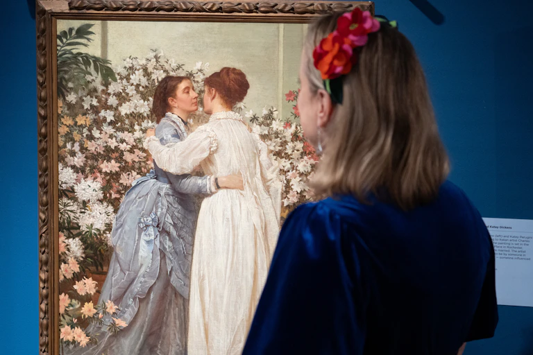 A portrait of Mamie Dickens and Katey Perugini among flowers on display in the exhibition.