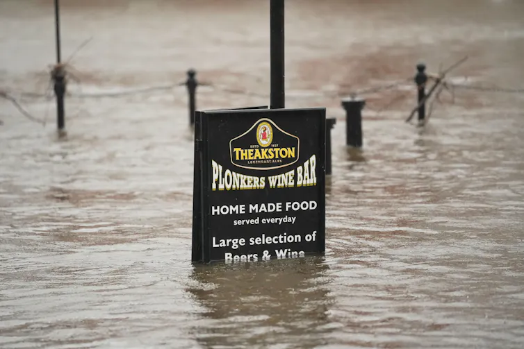 Plonkers wine bar sign in floodwaters