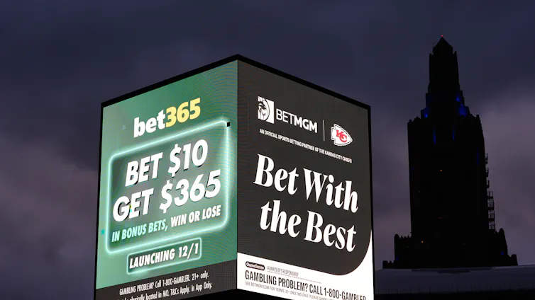 Advertisements for sports betting apps seen on a billboard