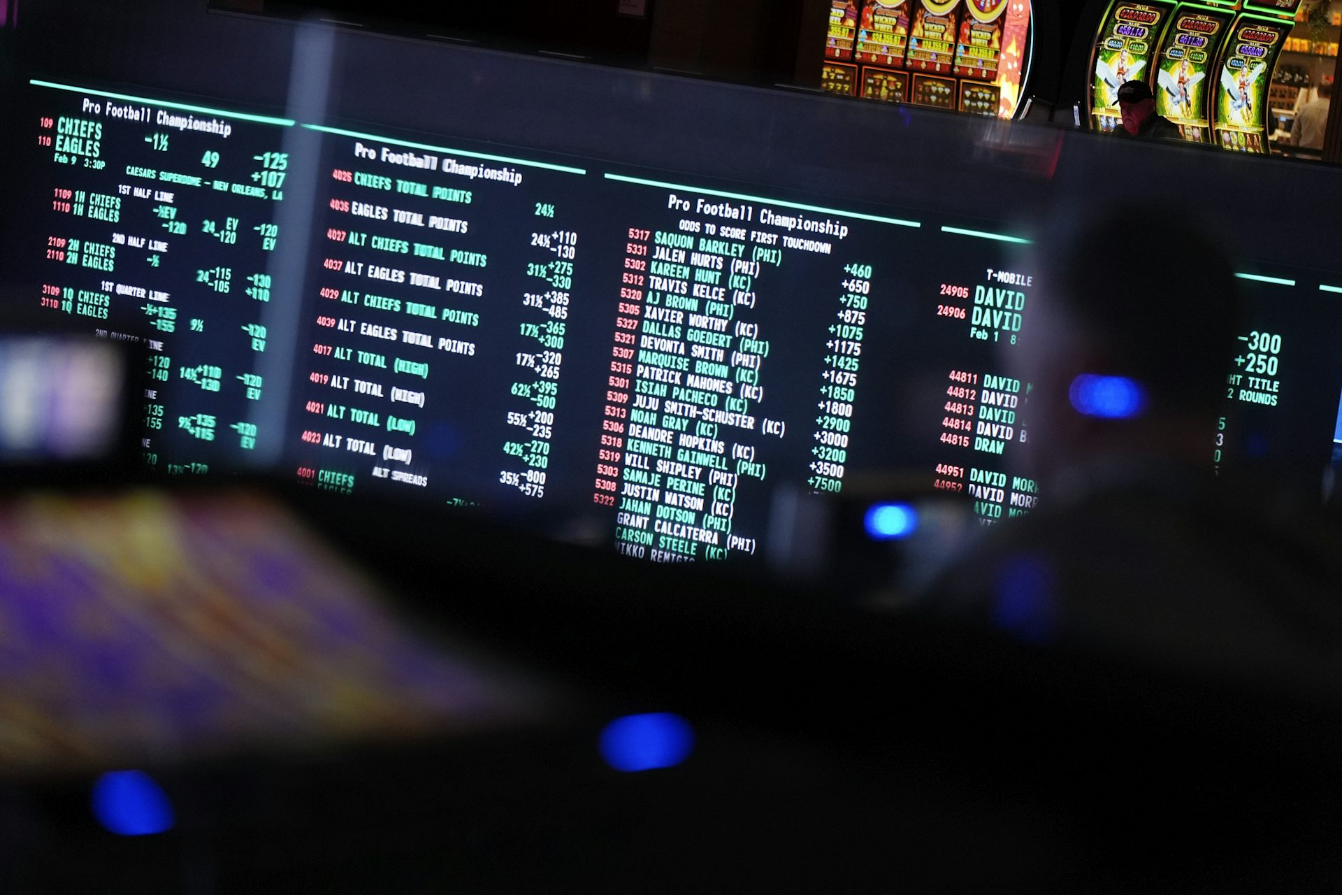 Betting odds for Super Bowl LIX are displayed on monitors
