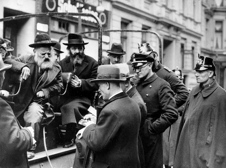 police questioning men in a car