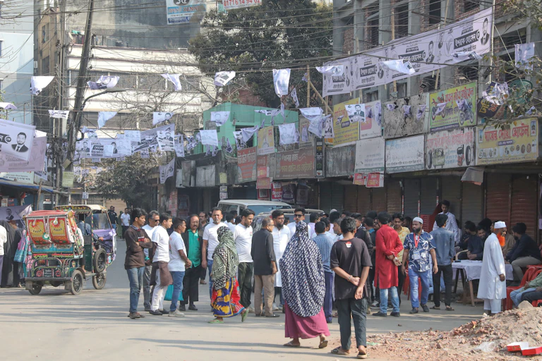 People gather outside of a voting centre in Dhaka.
