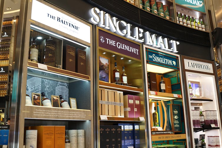 display cabinet in an airport duty free lounge of scottish single malt whiskies