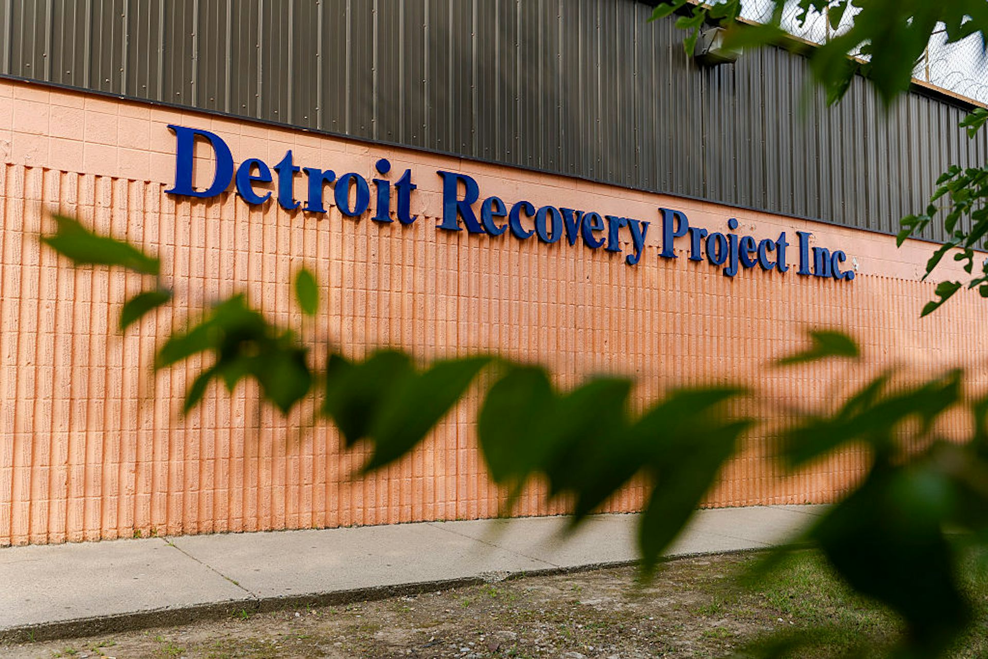 Exterior of building with a sign that reads: Detroit Recovery Project Inc.