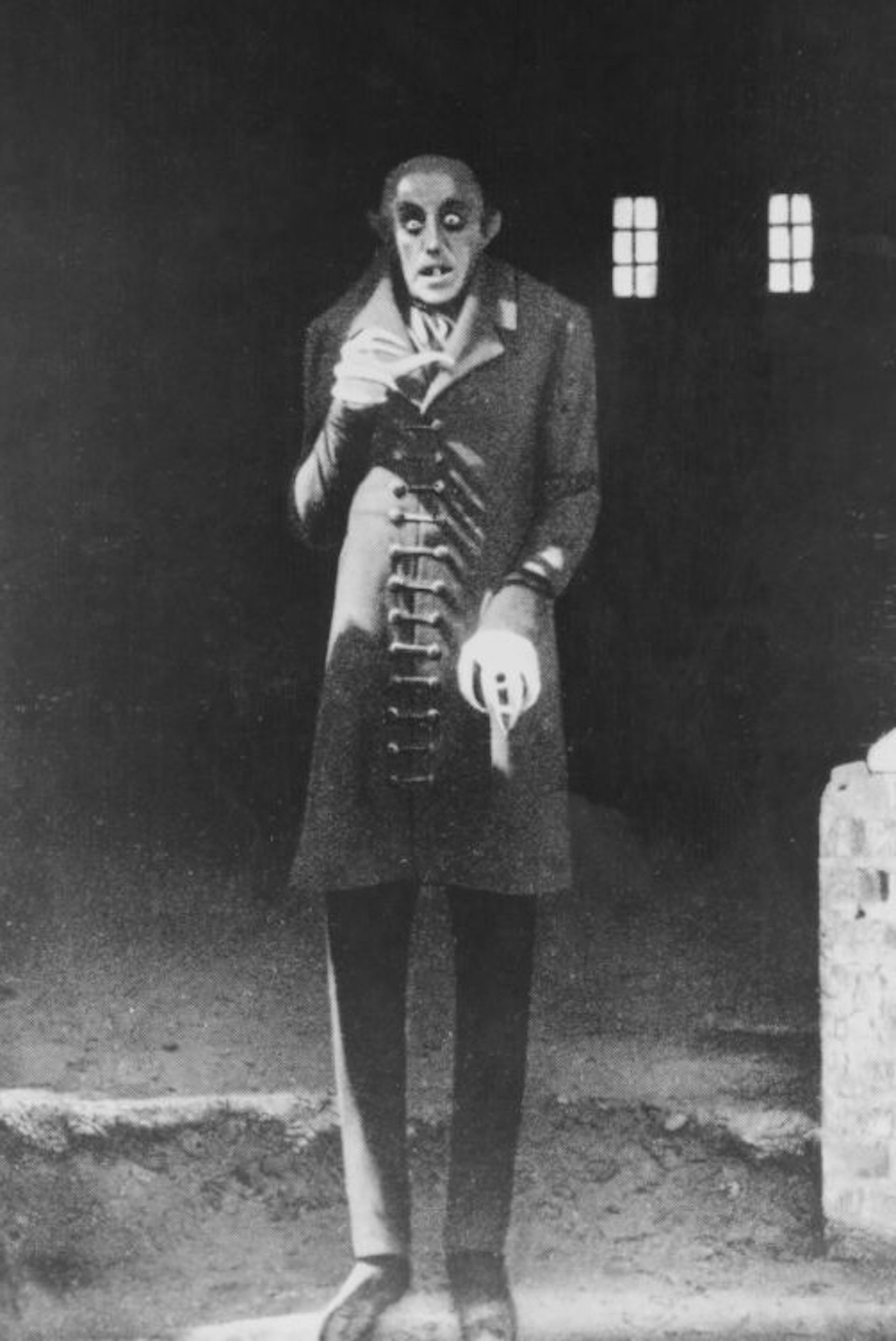 A bald, skinny, elderly vampire with hollow eyes.