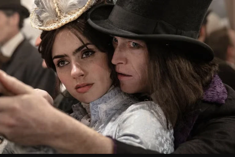 A young man in a top hat rests his chin on the shoulder of a young woman who looks uncomfortable.