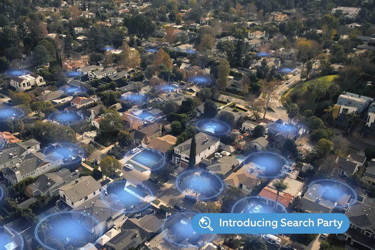 Aerial photo showing glowing blue circles indicating the view of surveillance cameras around suburban houses