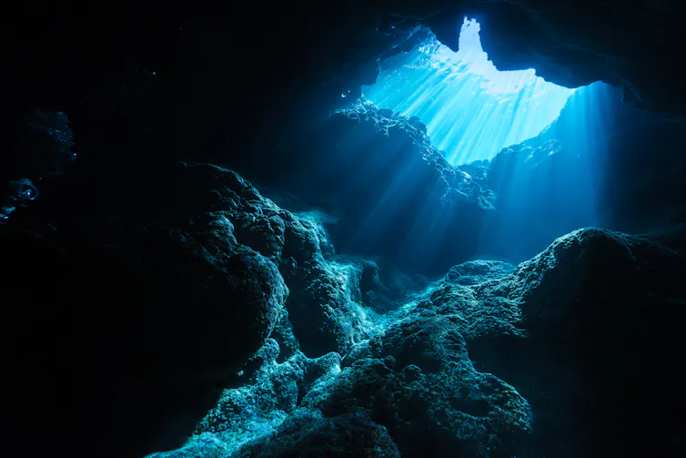 Light illuminating sea cave