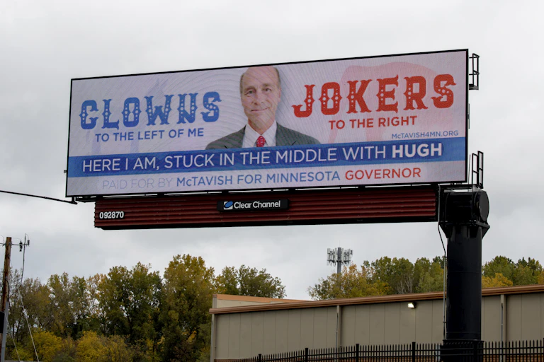 A billboard advertises a third-party candidate for Minnesota governor named Hugh McTavish.
