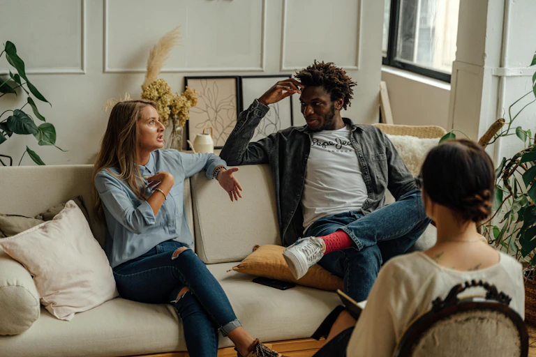 A couples talk while in therapy together.