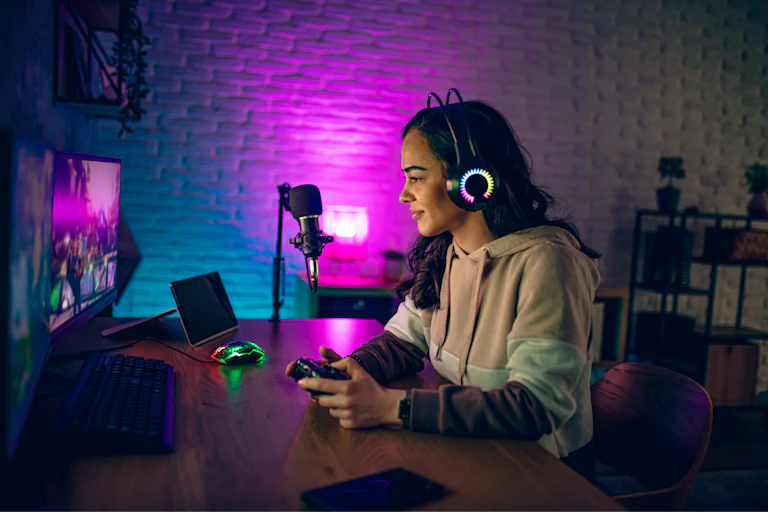 A young woman plays video games.