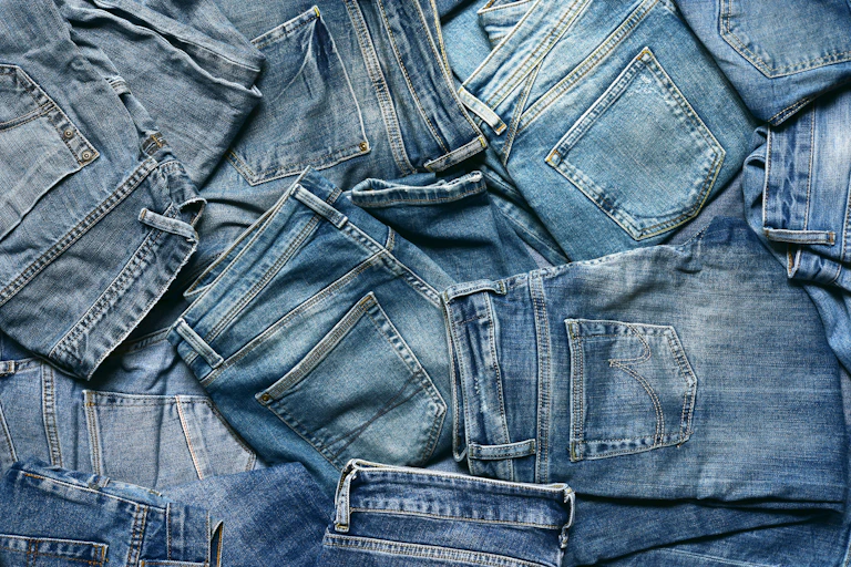 pile of denim jeans